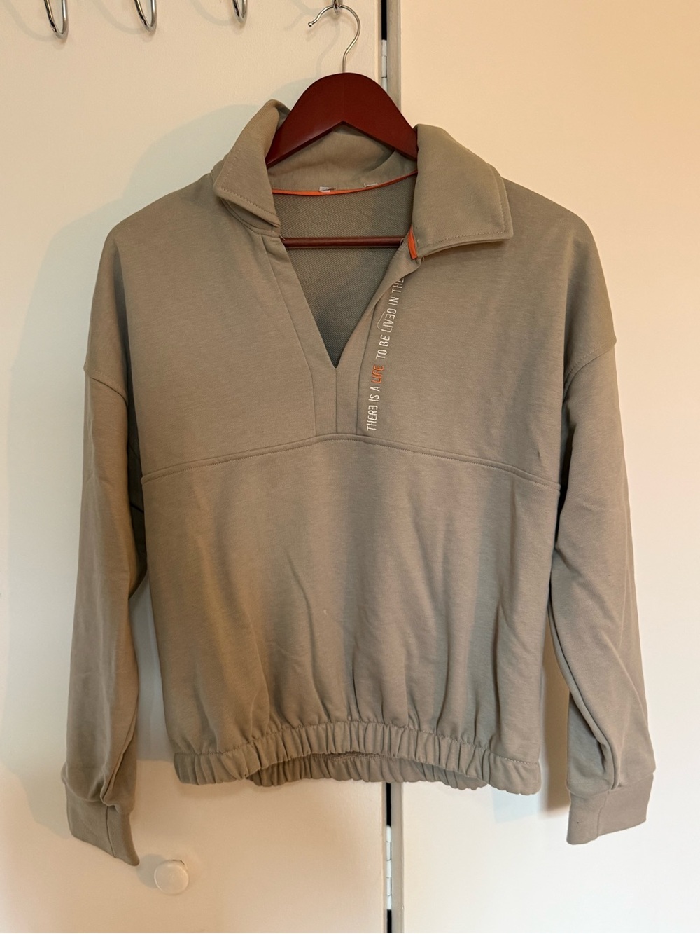 Beige V-neck Pullover with Subtle Accent